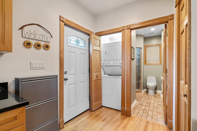 2222 Grey Ave, Evanston, IL 60201 - foyer entrance with stacked washer / drying machine and light wood-style flooring