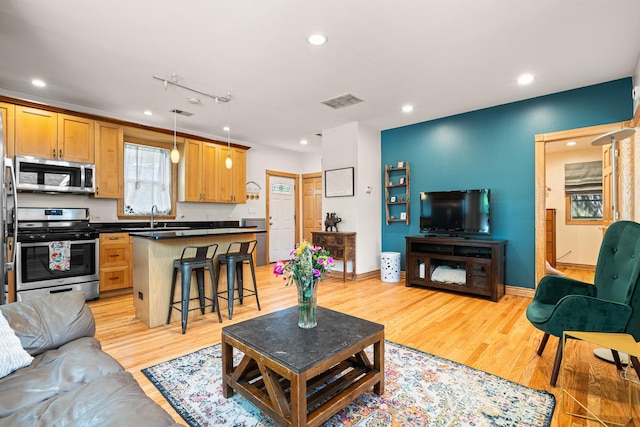 2222 Grey Ave, Evanston, IL 60201 - living area with light wood-type flooring and recessed lighting
