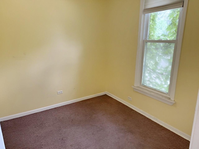 663 W 117th Pl, Chicago, IL 60628 - unfurnished room with dark carpet and baseboards