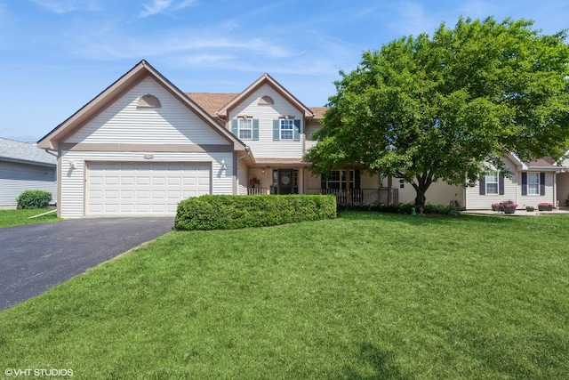 4705 Peacock Ln, Plainfield, IL 60586 - view of front of house featuring asphalt driveway, an attached garage, and a front yard