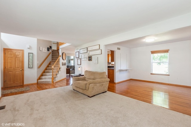 4705 Peacock Ln, Plainfield, IL 60586 - living area featuring wood finished floors and stairway