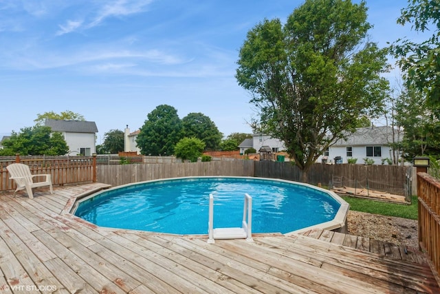 4705 Peacock Ln, Plainfield, IL 60586 - view of swimming pool featuring a wooden deck and a fenced backyard