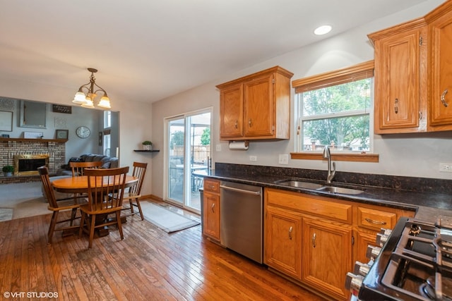 4705 Peacock Ln, Plainfield, IL 60586 - kitchen with dishwasher, hardwood / wood-style flooring, range, and brown cabinets