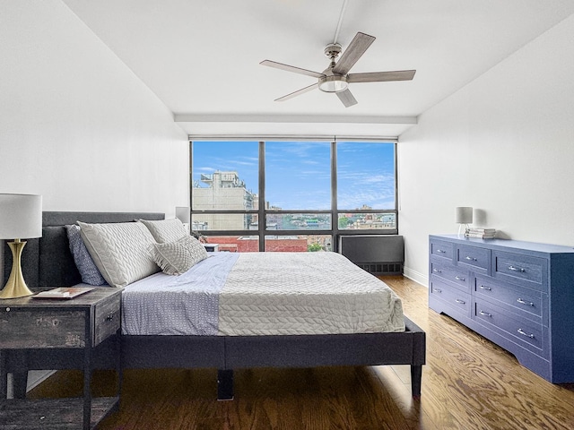 3150 N Sheridan Rd Unit 10C, Chicago, IL 60657 - bedroom with light wood-style flooring, expansive windows, and a ceiling fan