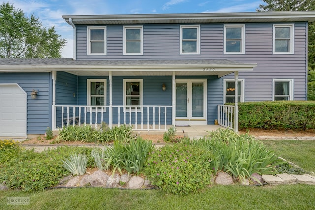 2430 Lakeside Dr, Aurora, IL 60504 - traditional-style house featuring a porch and a garage