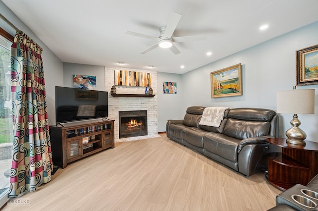 2430 Lakeside Dr, Aurora, IL 60504 - living room with a ceiling fan, light wood finished floors, a brick fireplace, and recessed lighting