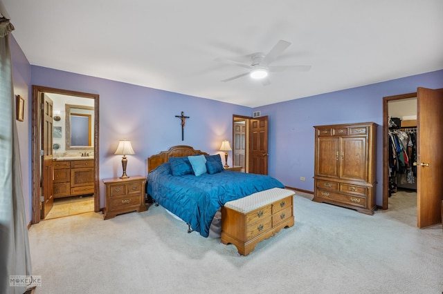 2430 Lakeside Dr, Aurora, IL 60504 - bedroom featuring light colored carpet, a walk in closet, ensuite bathroom, and ceiling fan