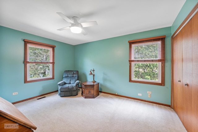 2430 Lakeside Dr, Aurora, IL 60504 - sitting room featuring healthy amount of natural light, carpet floors, and a ceiling fan