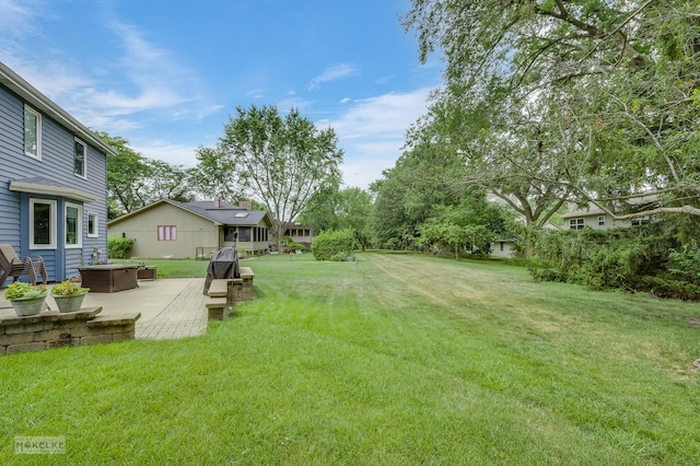 2430 Lakeside Dr, Aurora, IL 60504 - view of grassy yard with a patio area