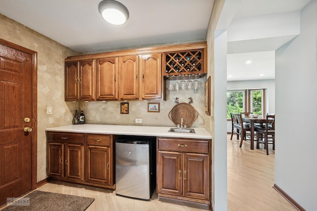 2430 Lakeside Dr, Aurora, IL 60504 - indoor wet bar featuring light wood-style floors and fridge
