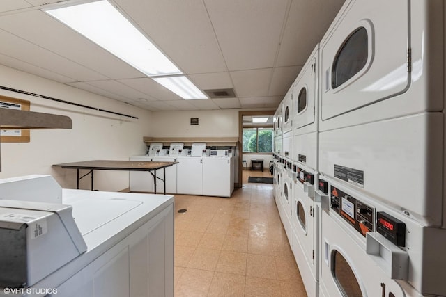 3341 Beacon St Unit 32, North Chicago, IL 60064 - shared laundry featuring stacked washer / drying machine, separate washer and dryer, and light flooring