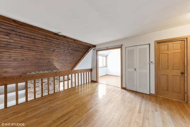 3341 Beacon St Unit 32, North Chicago, IL 60064 - additional living space with wood finished floors and vaulted ceiling