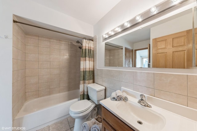 3341 Beacon St Unit 32, North Chicago, IL 60064 - bathroom with shower / bath combo with shower curtain, vanity, tile patterned floors, and tile walls