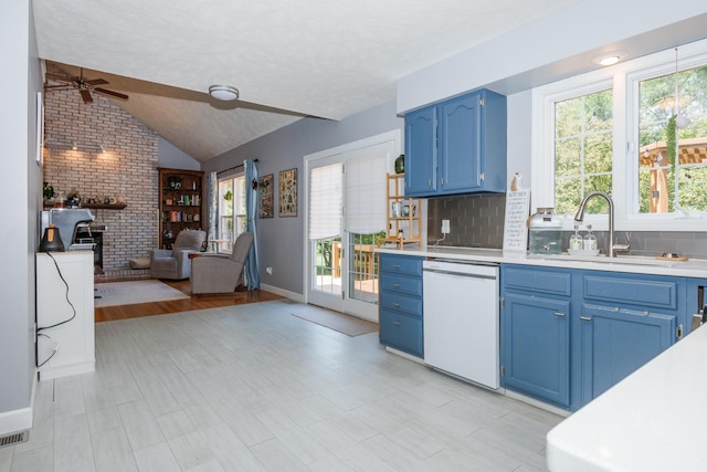 3308 Cumbria Dr, Bloomington, IL 61704 - kitchen with blue cabinets, white dishwasher, open floor plan, light countertops, and a ceiling fan