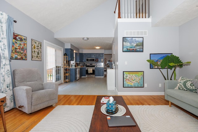 3308 Cumbria Dr, Bloomington, IL 61704 - living room with light wood finished floors and high vaulted ceiling