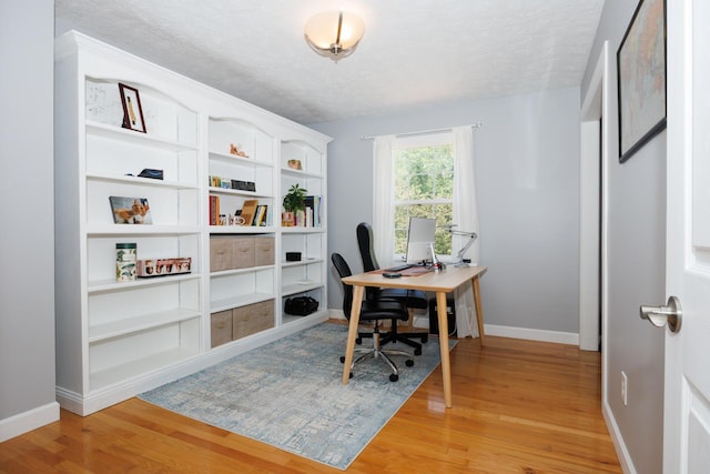 3308 Cumbria Dr, Bloomington, IL 61704 - office area with light wood-style floors and a textured ceiling