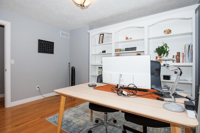 3308 Cumbria Dr, Bloomington, IL 61704 - office area with light wood-style floors and a textured ceiling