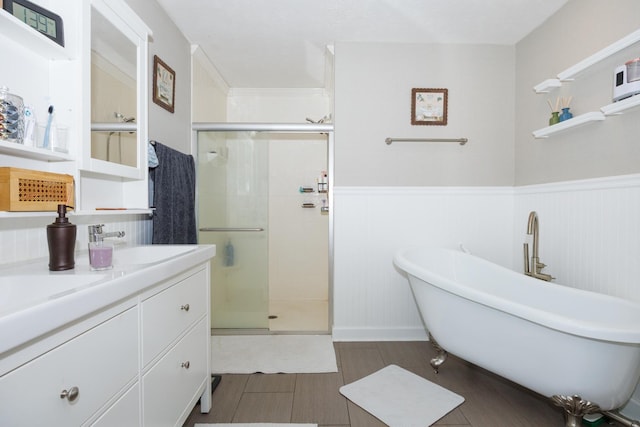3308 Cumbria Dr, Bloomington, IL 61704 - full bath with a shower stall, a freestanding tub, wainscoting, and vanity