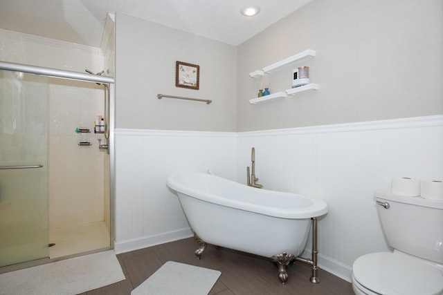 3308 Cumbria Dr, Bloomington, IL 61704 - full bathroom with a freestanding bath, wood finished floors, a stall shower, and wainscoting