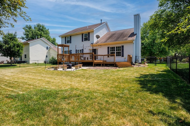 3308 Cumbria Dr, Bloomington, IL 61704 - rear view of property featuring a chimney, a fenced backyard, and a wooden deck