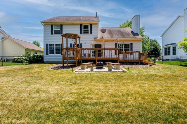 3308 Cumbria Dr, Bloomington, IL 61704 - rear view of property with a wooden deck, a chimney, and an outdoor fire pit