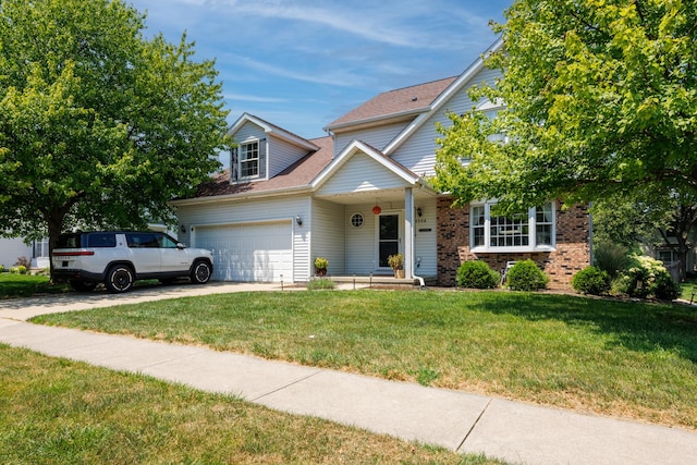3308 Cumbria Dr, Bloomington, IL 61704 - traditional home with a front lawn, driveway, a garage, brick siding, and roof with shingles
