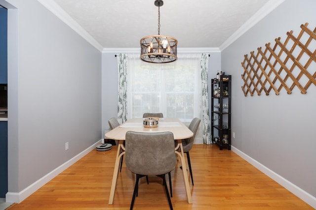 3308 Cumbria Dr, Bloomington, IL 61704 - dining space with a chandelier, light wood-type flooring, and ornamental molding