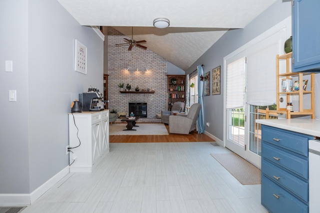 3308 Cumbria Dr, Bloomington, IL 61704 - living room with ceiling fan, lofted ceiling, and a brick fireplace