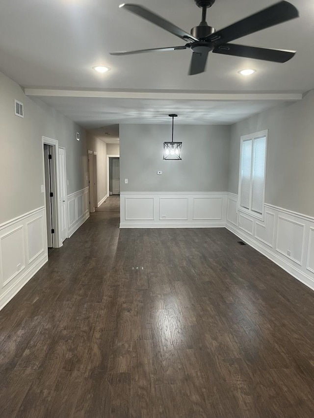 10200 S Union Ave, Chicago, IL 60628 - empty room featuring beam ceiling, ceiling fan, dark wood-style floors, a decorative wall, and wainscoting