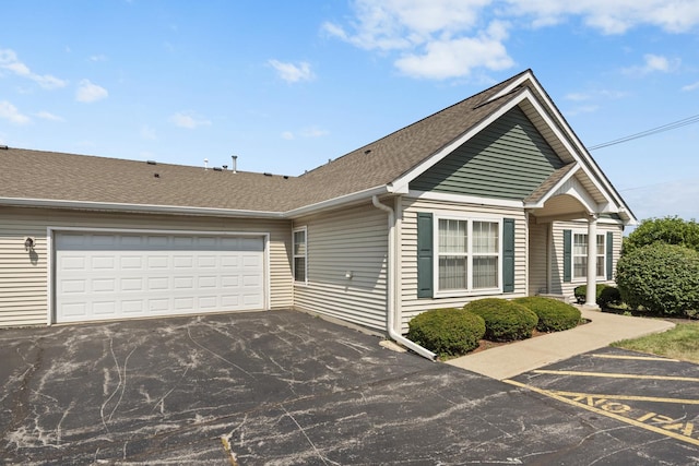 914 Garden Ln Unit 914, Homewood, IL 60430 - view of front of house with a shingled roof, asphalt driveway, and a garage