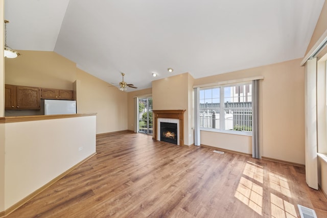 914 Garden Ln Unit 914, Homewood, IL 60430 - unfurnished living room with lofted ceiling, a lit fireplace, light wood finished floors, a ceiling fan, and recessed lighting