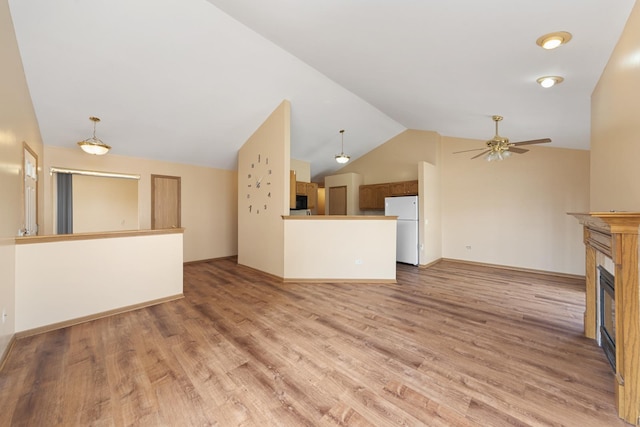 914 Garden Ln Unit 914, Homewood, IL 60430 - unfurnished living room featuring lofted ceiling, a fireplace, ceiling fan, and light wood finished floors