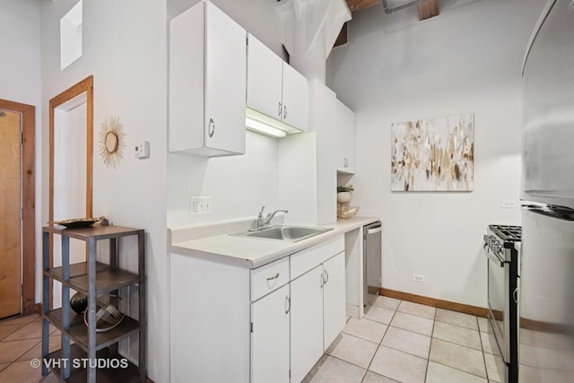 732 S Financial Pl Unit 202, Chicago, IL 60605 - kitchen featuring light countertops, stainless steel appliances, light tile patterned floors, and white cabinets