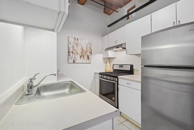 732 S Financial Pl Unit 202, Chicago, IL 60605 - kitchen with stainless steel appliances, under cabinet range hood, light countertops, and white cabinetry