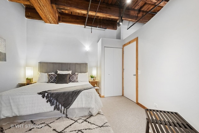 732 S Financial Pl Unit 202, Chicago, IL 60605 - carpeted bedroom featuring a wooden ceiling with exposed beams and a towering ceiling