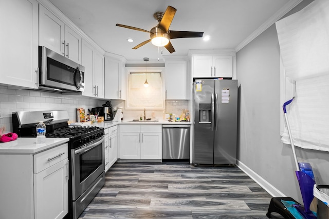 19 Apple Ln, Park Forest, IL 60466 - kitchen featuring appliances with stainless steel finishes, a ceiling fan, white cabinets, dark wood finished floors, and crown molding