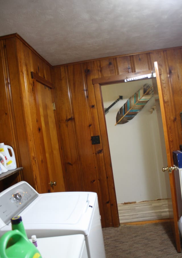 1 Elm Dr, Bethany, IL 61914 - washroom with washing machine and clothes dryer, wooden walls, and a textured ceiling
