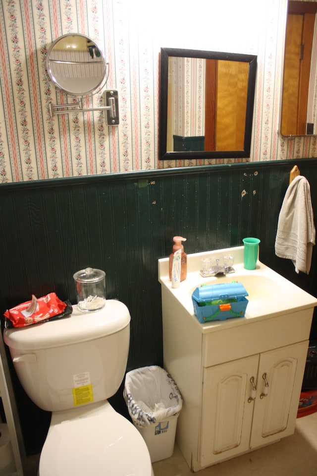 1 Elm Dr, Bethany, IL 61914 - half bathroom with wallpapered walls, wainscoting, and vanity