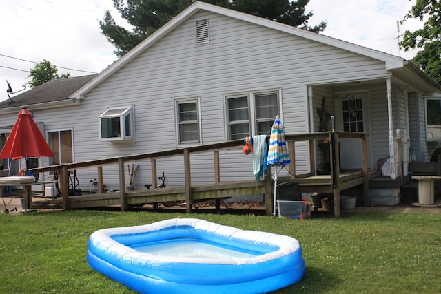 1 Elm Dr, Bethany, IL 61914 - back of house featuring a deck and a yard