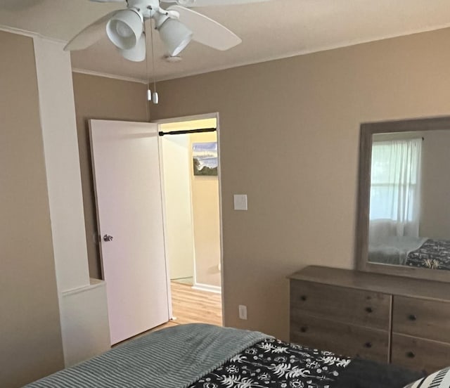 1302 Briarcliff Dr, Urbana, IL 61801 - bedroom with wood finished floors and ceiling fan