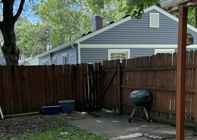 1302 Briarcliff Dr, Urbana, IL 61801 - view of patio / terrace featuring a grill and a gate