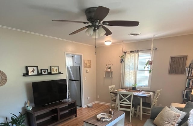 1302 Briarcliff Dr, Urbana, IL 61801 - living room featuring wood finished floors, ceiling fan, and ornamental molding