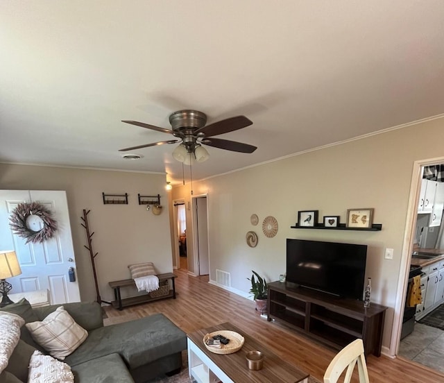 1302 Briarcliff Dr, Urbana, IL 61801 - living room with ceiling fan, ornamental molding, and wood finished floors