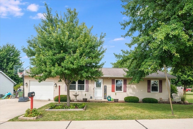 505 Tamula Dr, Mahomet, IL 61853 - view of front of property with concrete driveway, a front yard, and a garage