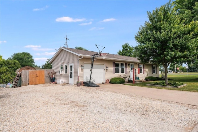 505 Tamula Dr, Mahomet, IL 61853 - ranch-style house featuring driveway, a garage, and a gate
