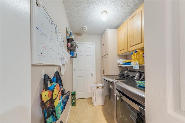 505 Tamula Dr, Mahomet, IL 61853 - laundry room featuring washer and clothes dryer, cabinet space, and a textured ceiling