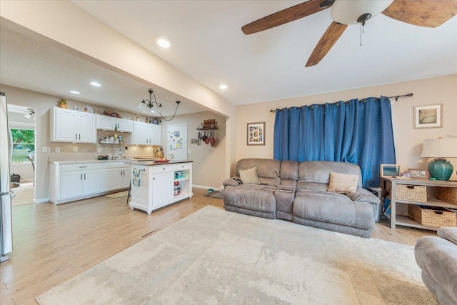 505 Tamula Dr, Mahomet, IL 61853 - living area featuring light wood-style flooring, a ceiling fan, and recessed lighting