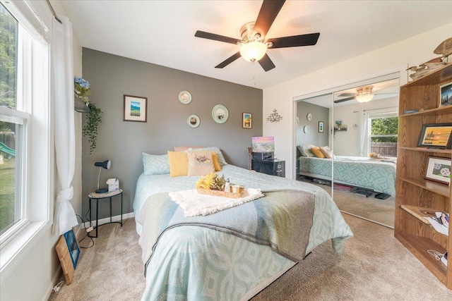 505 Tamula Dr, Mahomet, IL 61853 - bedroom featuring carpet flooring, a ceiling fan, and a closet