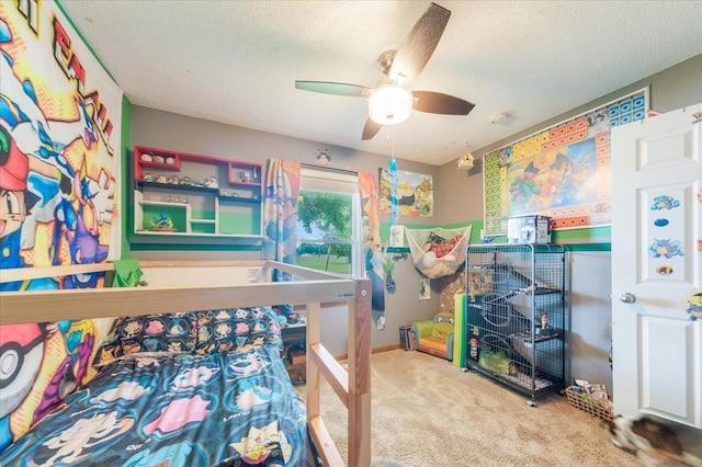 505 Tamula Dr, Mahomet, IL 61853 - carpeted bedroom with a textured ceiling and a ceiling fan