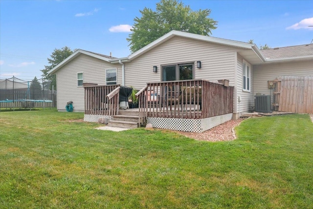 505 Tamula Dr, Mahomet, IL 61853 - back of house with a trampoline and a wooden deck